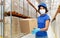 Delivery woman in face mask holding parcel box