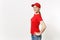 Delivery woman in red uniform isolated on white background side view. Professional female in cap, t-shirt, jeans working