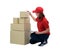 Delivery woman in red uniform with Parcel boxes making notes on delivery receipt clipboard, isolated on white