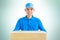 Deliveryman carrying a cardboard parcel box