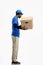 The deliveryman, full-length, on a white background, with a box