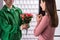 Deliveryman give flower to office customer