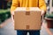 Deliveryman hands holding a cardboard parcel box giving fast delivery service, transportation and logistics concept. Generative AI