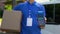 Deliveryman holding box and payment terminal, credit card device, client care