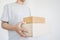 Deliveryman holding parcel boxes package, on white background