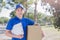 Deliveryman take cardboard