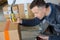 Deliveryman in warehouse loading cardboard boxes into truck