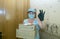 A deliverywoman. A middle-aged woman brought pizza home to a customer. The deliveryman`s work in the conditions of coronavirus