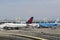 Delta Airline Boeing 747 and KLM Boeing 777 at the gates at the Terminal 4 at John F Kennedy International Airport in New York