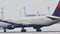 Delta Airlines taking off from Munich Airport, snow