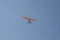 Delta wing with engine flies by the blue sky