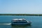 Deltebre, Spain - 22 august 2019: tourists enjoy a sighseeing boat tour on ebro river delta on a sunny summer. Mass tourism is