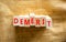 Demerit symbol. The concept word Demerit on wooden blocks. Beautiful canvas background, copy space. Business and demerit concept