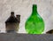 Demijohn wine bottle at cafe in Trulli village in Alberobello, Italy