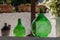 Demijohn wine bottles at cafe in Trulli village in Alberobello