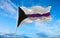 Demisexual Pride flag waving in the wind at cloudy sky. Freedom and love concept. Pride month. activism, community and freedom