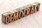 Democracy word abstract in wood type