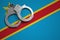 Democratic Republic of the Congo flag and police handcuffs. The concept of crime and offenses in the country