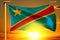 Democratic Republic of Congo flag weaving on the beautiful orange sunset with clouds background