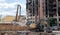 Demolition of a high-rise building. The collapse of a residential building. Construction work on the demolition of multi-storey
