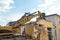 Demolition of a house by an excavator