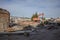 Demolition of obsolete dilapidated buildings. A large orange excavator stands on the rubble of a demolished building