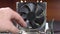 Demonstration of dust pollution. Dirty cooler and CPU heatsink from dust.