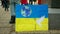 Demonstration people against Russian military attack war Russia on Ukraine flag, banner of hope doves and planet earth