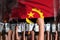 demonstration stopping concept - protest in Angola on flag background, police guards stand against the protesting crowd -