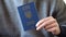 Demonstration of the Ukrainian biometric passport in close-up. Passport in hand.