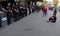 Demonstrator sitting front of Spain Police controls to access to international Sants rails station in Barcelona