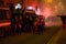 Demonstrators launching smoke canisters to police in front of the Turkish consulate in Milan, Italy