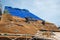 Den Helder, Netherlands. September 2022. Thatchers work on a new thatched roof.