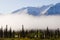 Denali mountains cover by snow with fog