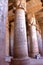 DENDERA, EGYPT - NOVEMBER 2, 2011: The huge pillars and beautiful ceiling inside Dendera temple dedicated to Hathor goddess