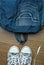 Denim backpack and sneakers