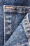 Denim blue jeans pocket texture, large detailed vertical macro closeup, textured detail pattern