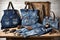Denim handbags upcycled from faded jeans on rustic dressmaker table. zero waste lifestyle. handmade fashion