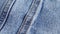 Denim jeans blue texture with seams.