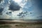 Denmark coast - dramatic sky and beach with horizon