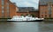 Denmark, Copenhagen, Christians Brygge, a pleasure boat in the waters of the Christianshavn Canal