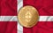 Denmark flag  ethereum gold coin on flag background. The concept of blockchain  bitcoin  currency decentralization in the country