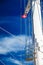 Denmark flag on ship mast, blue sky in background