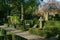 Denmark, Frederiksberg - May 6, 2018: Peaceful graveyard in spring sunny day, beautiful decorative gardening in cemetery