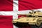 Denmark modern tank with not real design on the flag background - tank army forces concept, military 3D Illustration