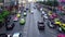 Dense city traffic. Asia, Bangkok. Motorcycles drive between rows of cars