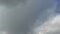 Dense cumulus clouds against the clear blue sky. Nice weather, time-lapse.