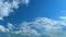 Dense Cumulus Clouds On A Clear Blue Sky. White Clouds In Blue Sky. Picturesque View Of Blue Sky With Fluffy Clouds