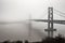 Dense dense fog cloud over the river bridge, architecture in a smoky effect. AI generated.