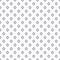 Dense dotted black rhombus pattern on off white background